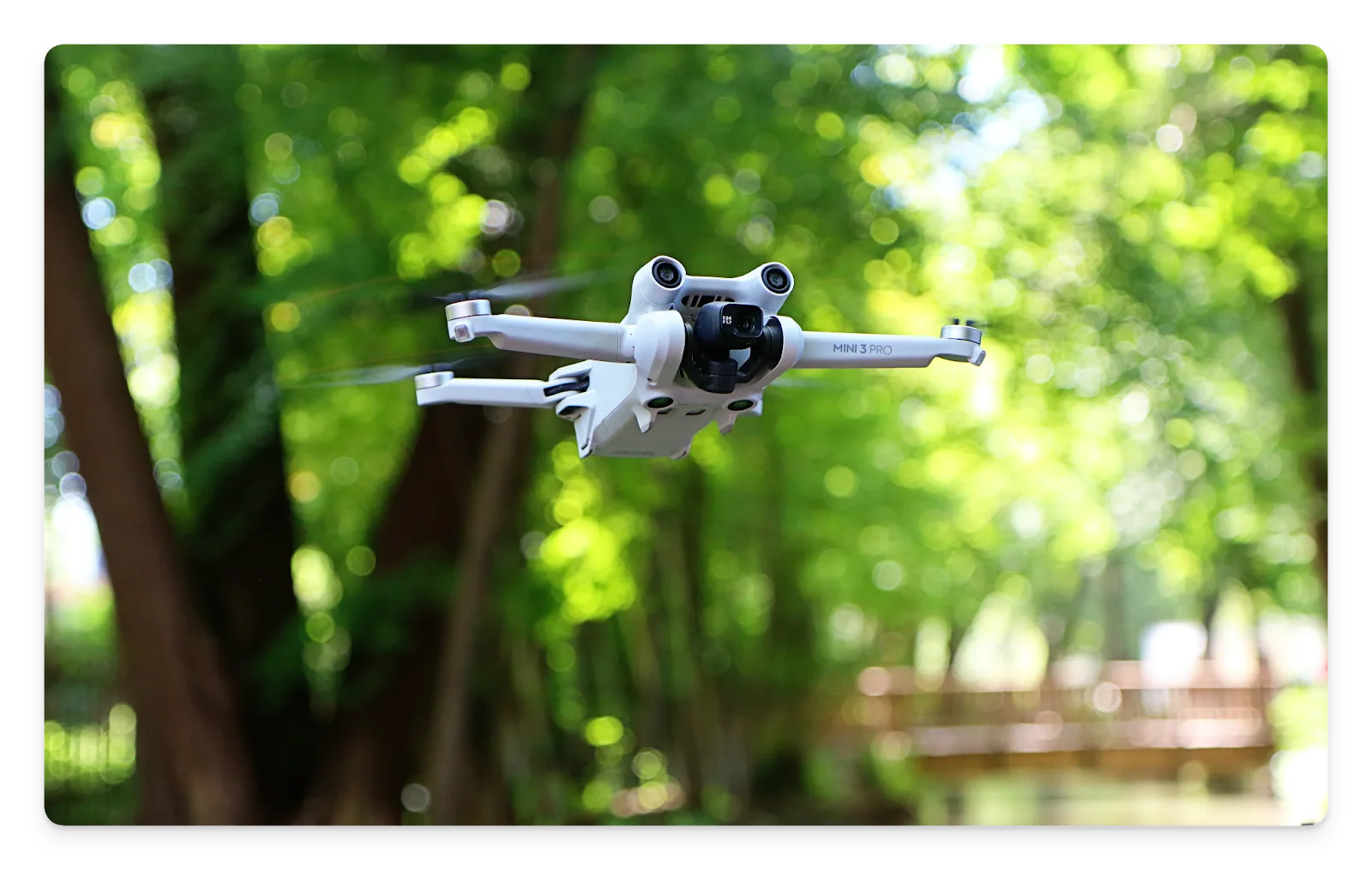 A photo of the DJI Mini 3 Pro in flight.