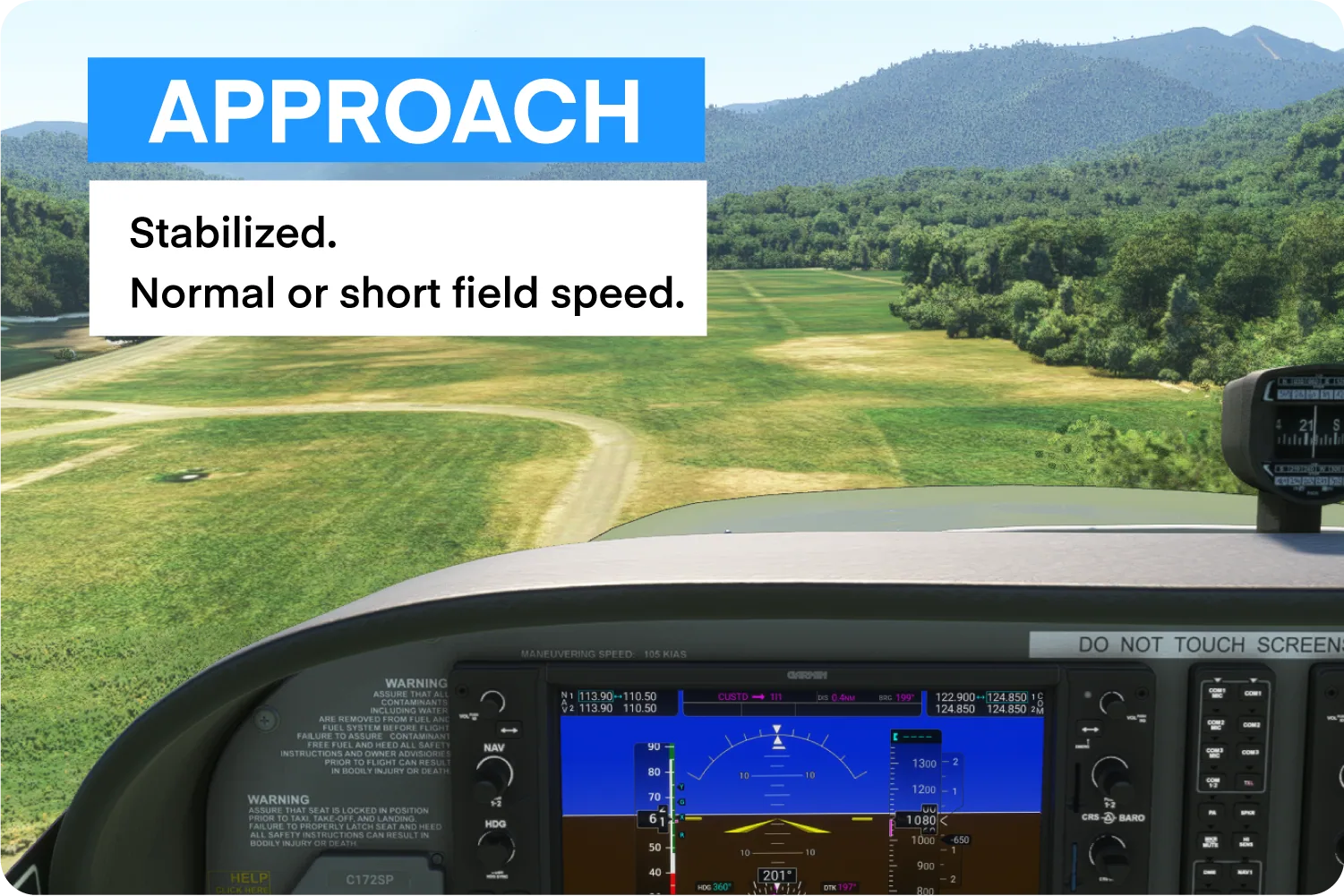 Aircraft approaching grass runway.
