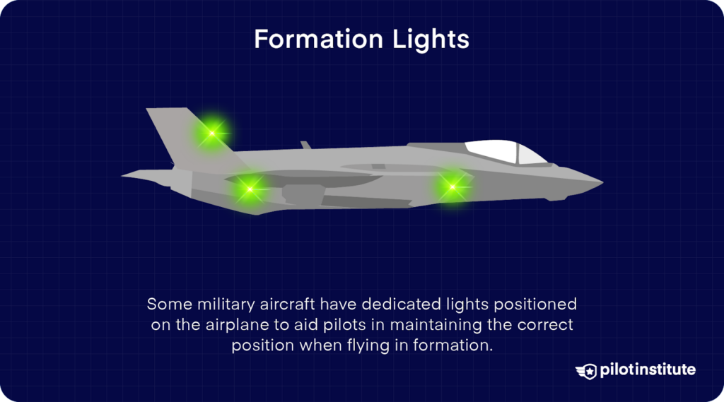 Military aircraft with green formation lights aiding pilots in maintaining formation positioning.