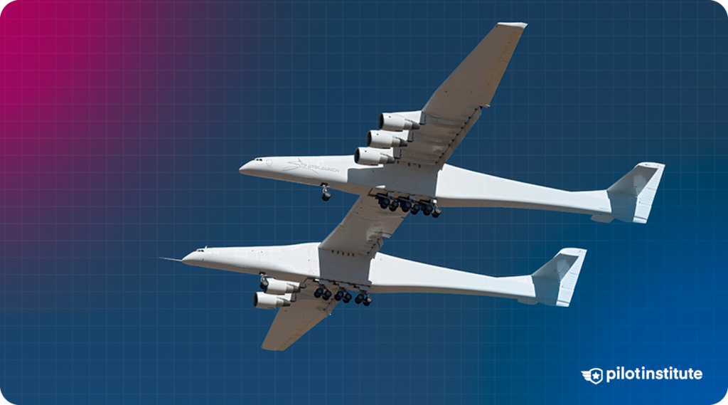 Photo of a Scaled Composites Stratolaunch flying in the clear blue sky.