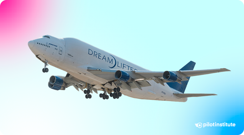 Photo of the Boeing Dreamlifter flying in the clear blue sky.