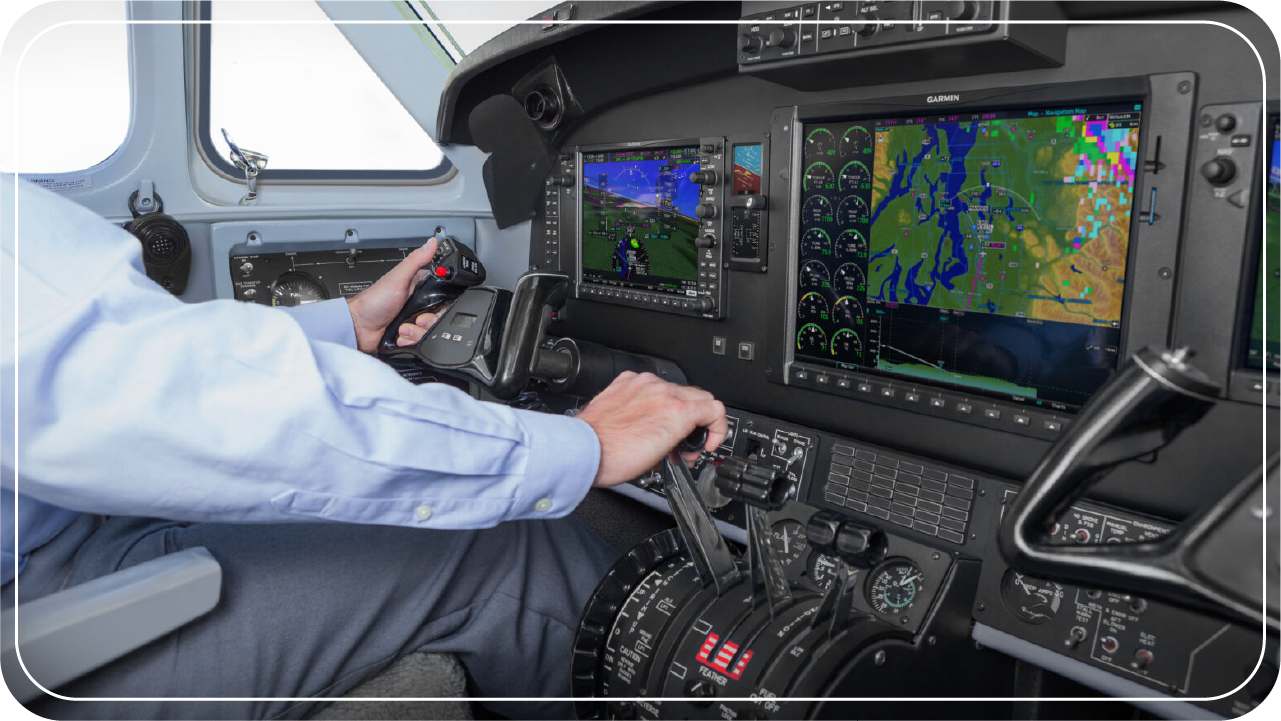 Pilot at the controls of a Garmin G1000 NXi-equipped aircraft.