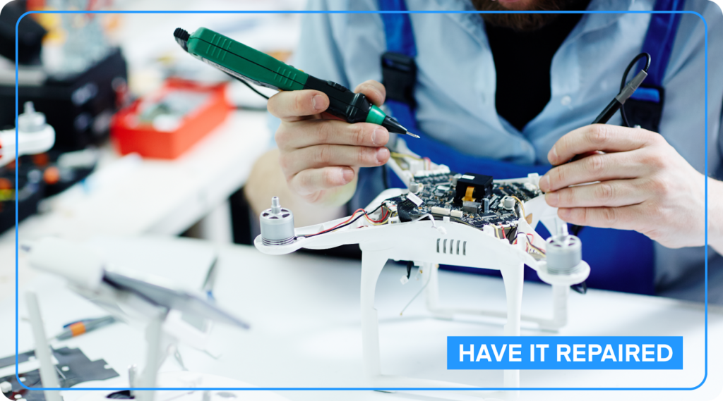 Person repairing a drone.