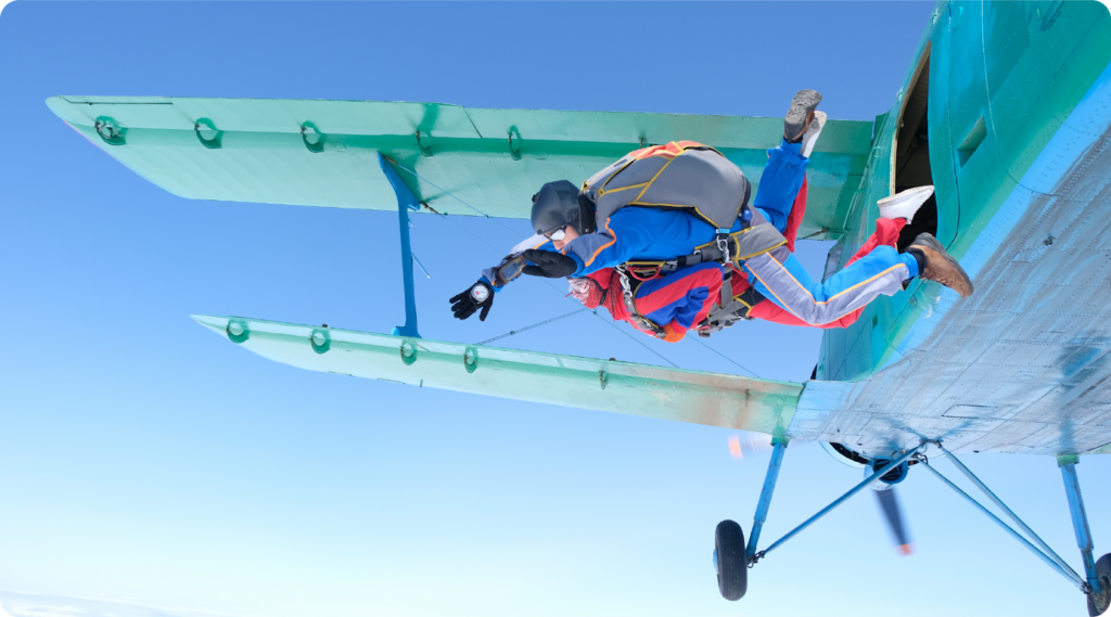 Skydivers jumping out of an airplane.