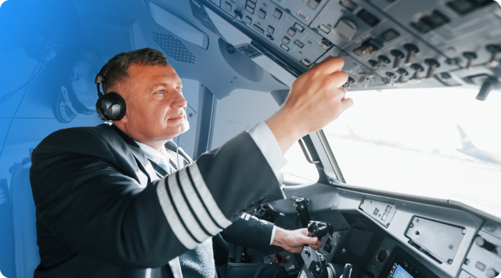 An airline pilot in the cockpit.