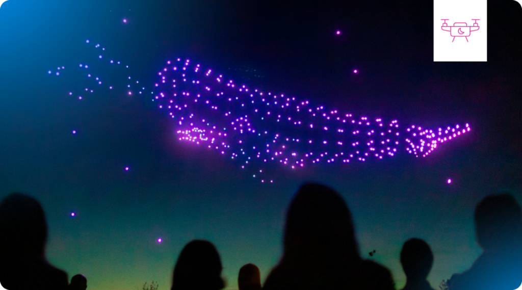 A drone light show in the shape of a whale.