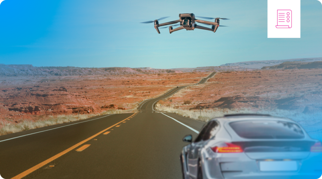 A drone operating over moving vehicles on a highway.